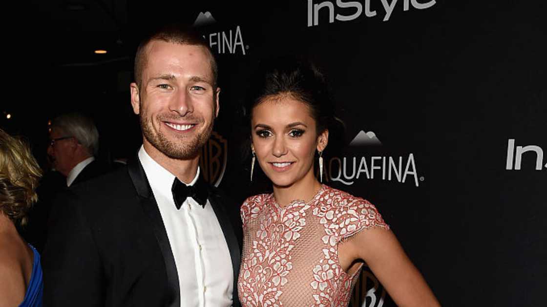 Actors Glen Powell (L) and Nina Dobrev (R) attend a party in 2016