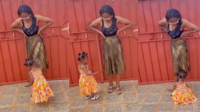 "I need to hire this little girl" – Little girl mǝlt hearts as she helps her mum strike a pose to take a picture (WATCH)