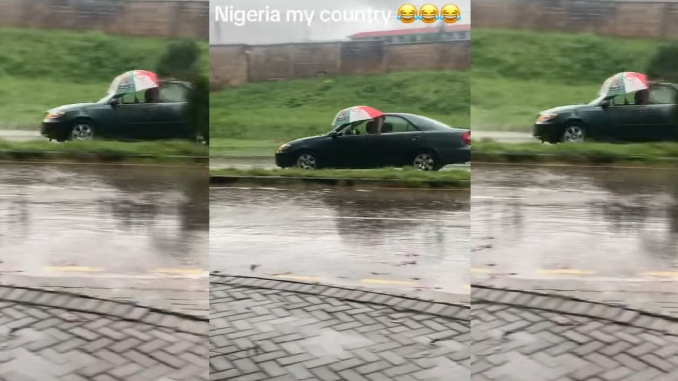 "The glass no fit wind up be that" – Driver refuses to close car window, opts for umbrella in heavy rain (VIDEO)