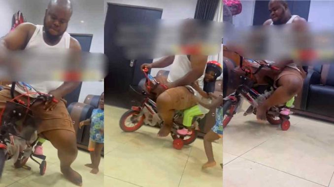 Nigerian man rides a bicycle with children, shows off paternal love (VIDEO)