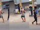 "Husband material" – Man spotted joyfully strolling with a child on his back in Onitsha (WATCH)