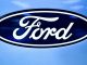 Hefty electric vehicle costs dent Ford profits