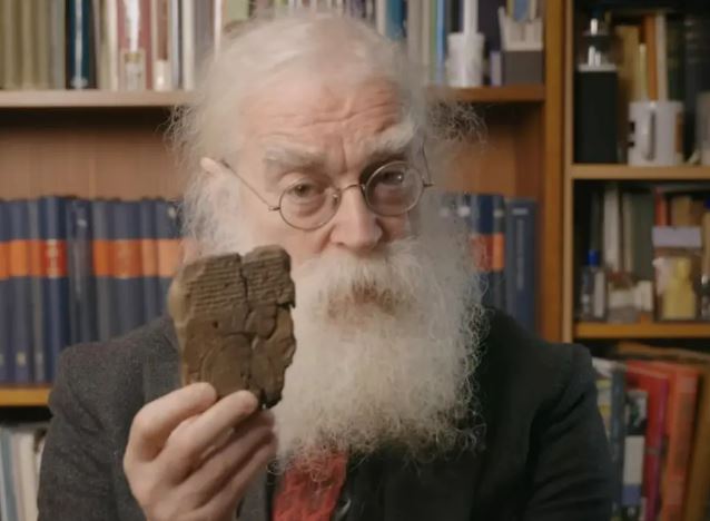 Dr. Irving Finkel holding the "oldest map in the world"