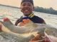 Man, 23, drowns after hooking monster fish & losing his balance as he pulled it out water in front of horrified pals