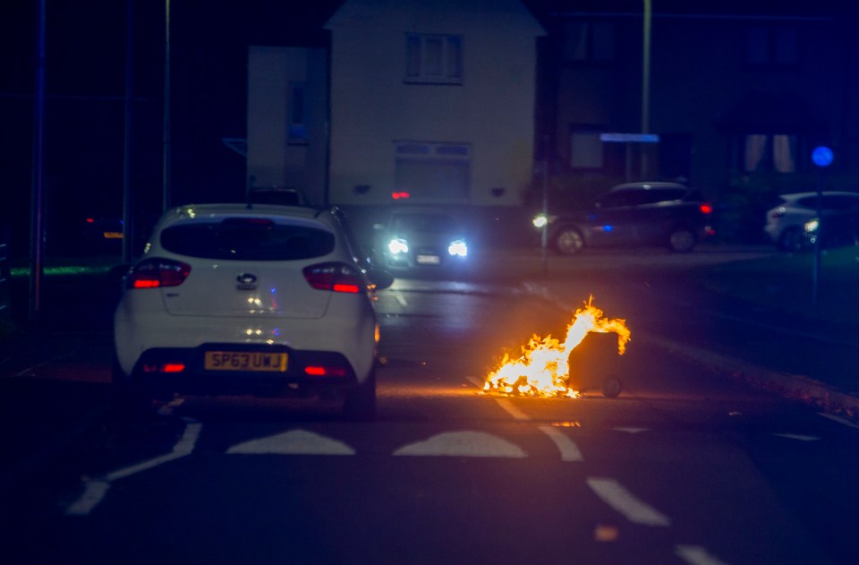 A wheelie bin was set alight in the middle of a road