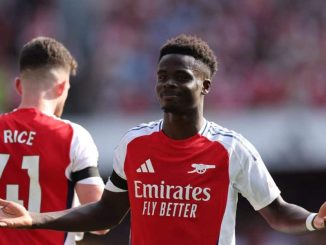 Bukayo Saka celebrates after scoring for Arsenal in their Premier League opener.