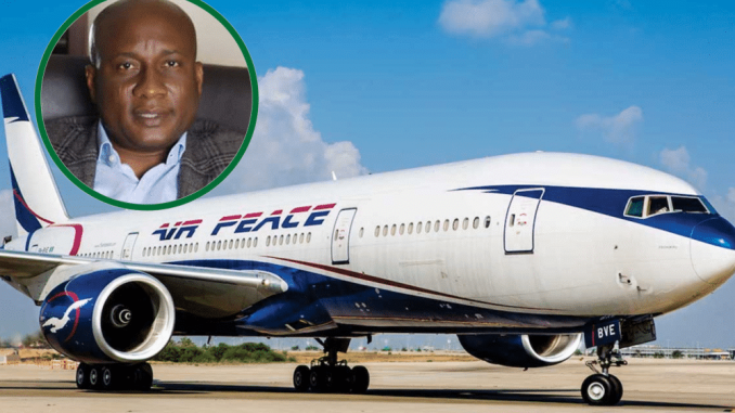 Airpeace aircraft on the tarmac with a picture of the airline CEO, Allen Onyema