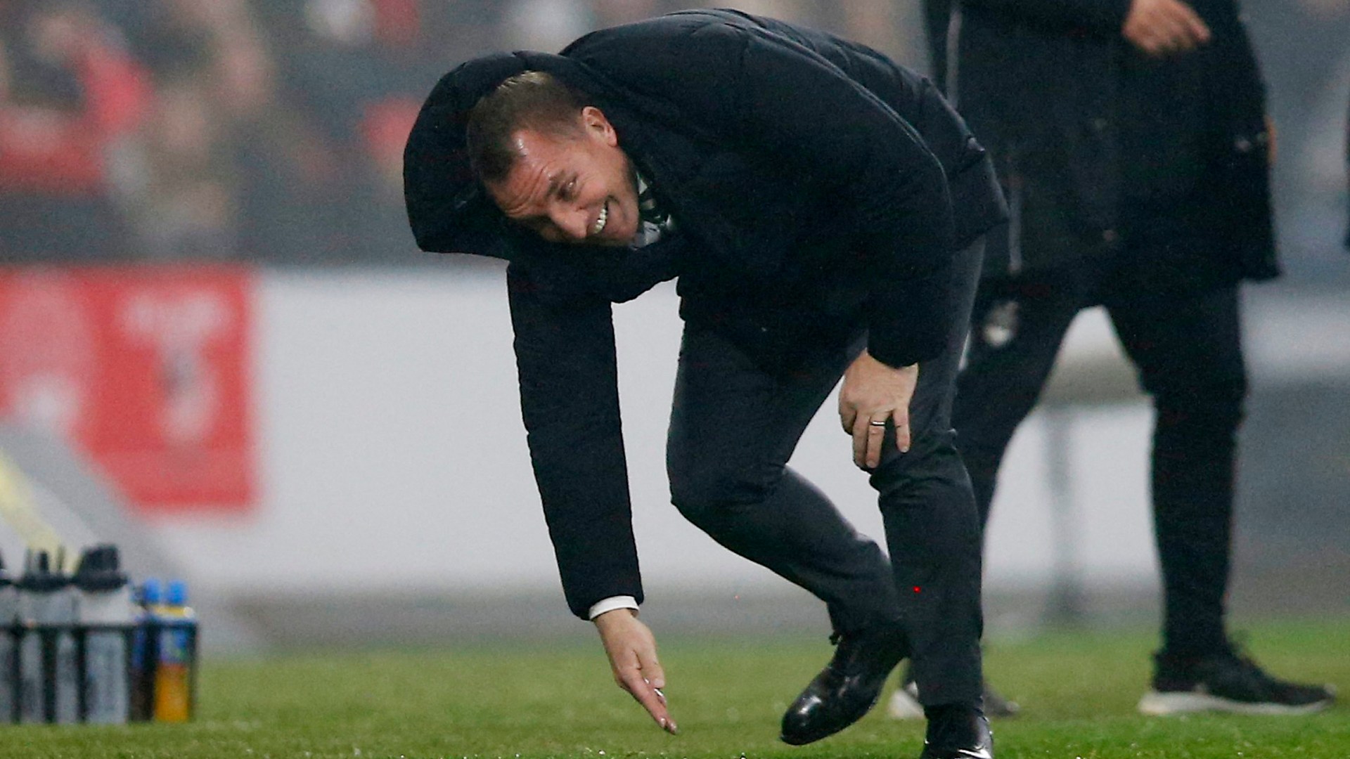 Embarrassing moment Celtic boss Brendan Rodgers falls in the mud at Hampden then gets BOOKED