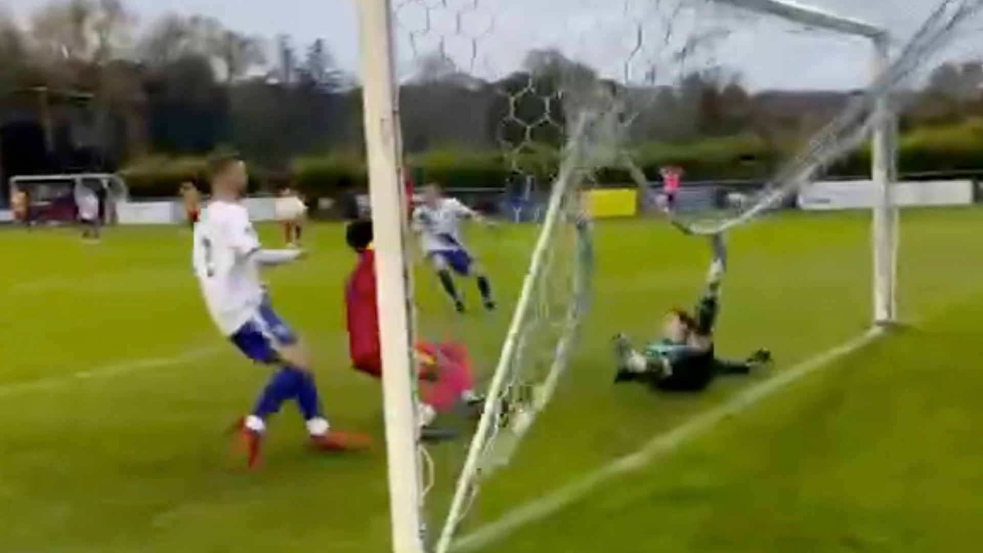 'Non-league at its best', joke fans after goalkeeper gets stuck in his own NET... but still makes worldie of a save