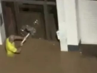 Moment ‘hero’ teacher smashes door with table leg to rescue kids as young as 5 trapped in school by rising Spain floods