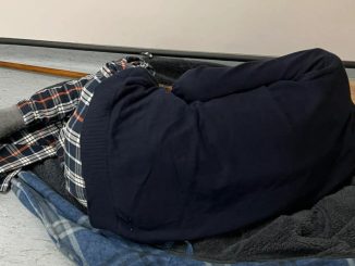 Harrowing picture shows pensioner with pneumonia, 75, curl up on dressing gown on hospital FLOOR in 12-hour wait for bed