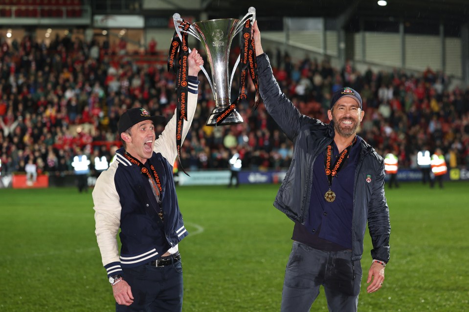 Wrexham’s celebrity owners Rob McElhenney and Ryan Reynolds celebrate the club’s promotion in April last year