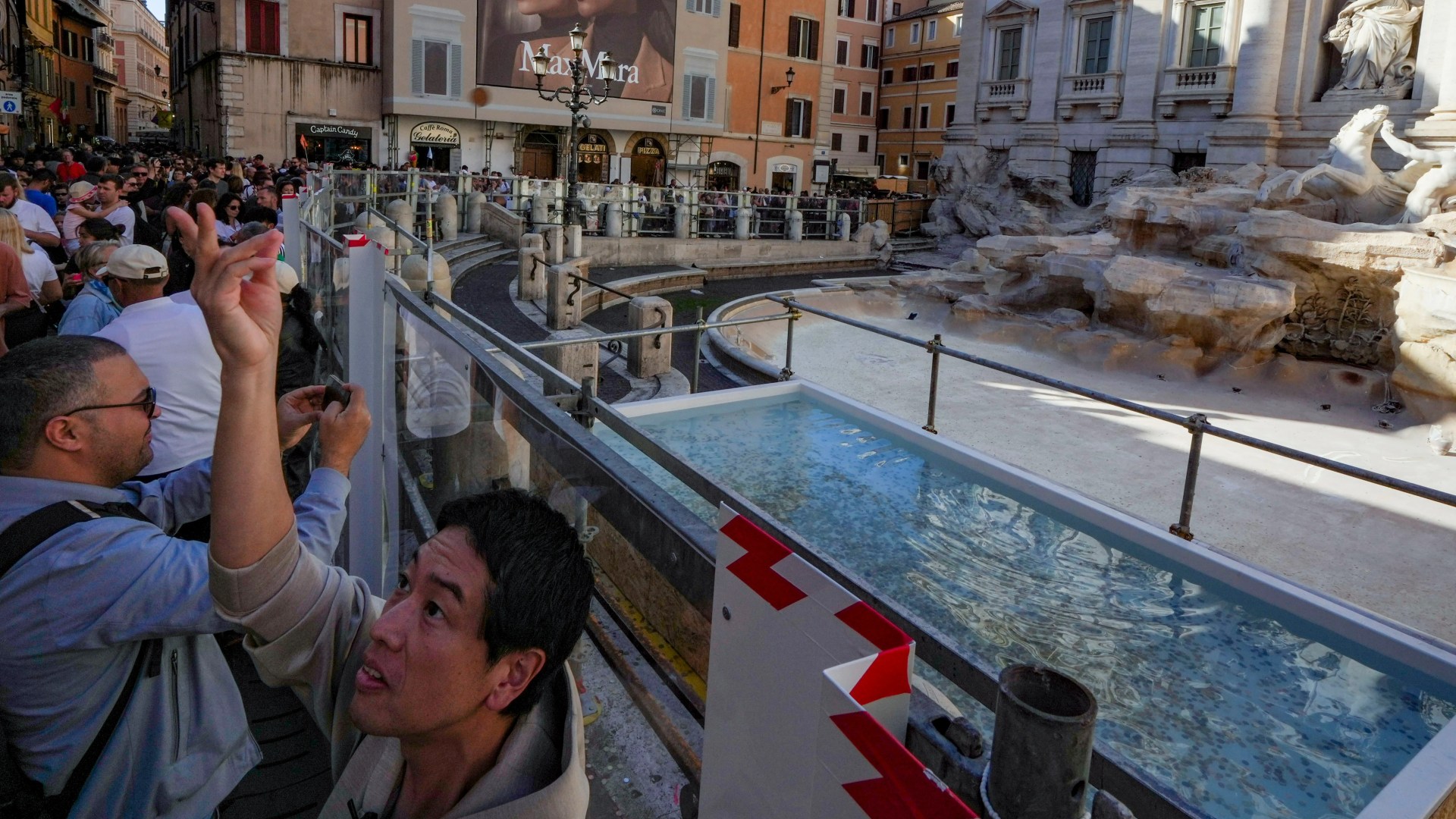 Europe's most famous coin-tossing fountain has been replaced by a tiny 'ugly' pool - and tourists are not happy