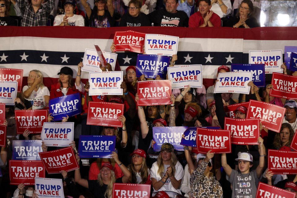 Supporters of Donald Trump cheer during a rally in Greenville, North Carolina, on October 21