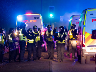 Shocking moment Bonfire Night yobs launch glass bottles at riot cops as terrified locals brand Scots city a 'war zone'