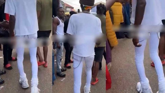 "how did he even put them on" – Man Turns Heads As He Rocks White Skinny Jeans Confidently At A Local Market (WATCH)