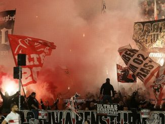 Ball boy injured after being hit in the neck by a burning flare during Champions League clash