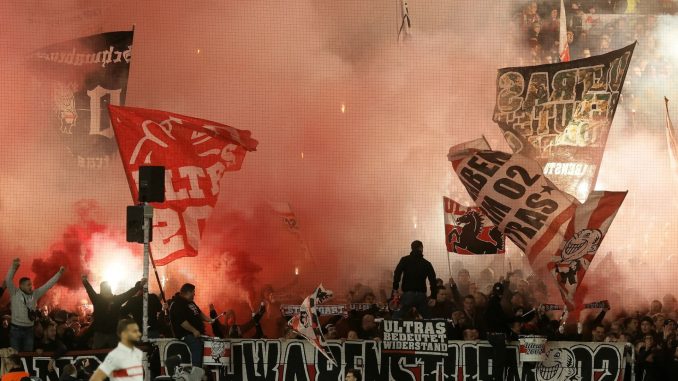 Ball boy injured after being hit in the neck by a burning flare during Champions League clash