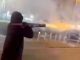 Watch shocking moment hooded man with ROCKET LAUNCHER shoots fireworks at people in busy city centre