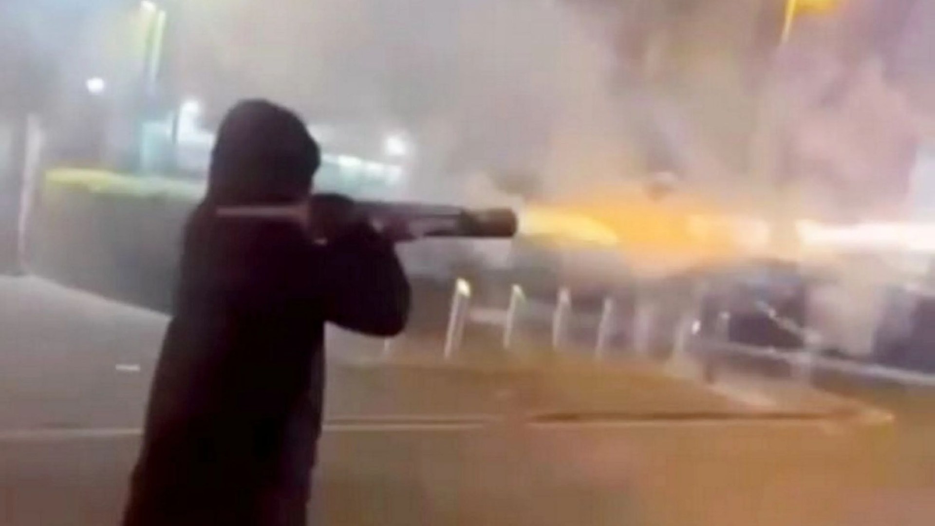 Watch shocking moment hooded man with ROCKET LAUNCHER shoots fireworks at people in busy city centre