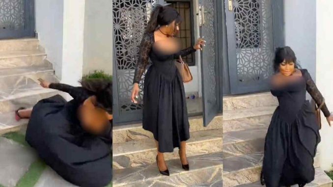 "I won’t stand up o" – Emb@rrassing moment a Nigerian lady tr!ps over heels on stairs in a video shoot (WATCH)