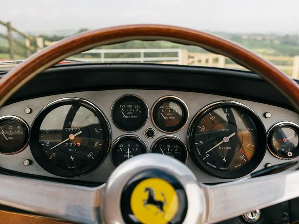 The wood-rimmed steering wheel gives the motor a timeless feel