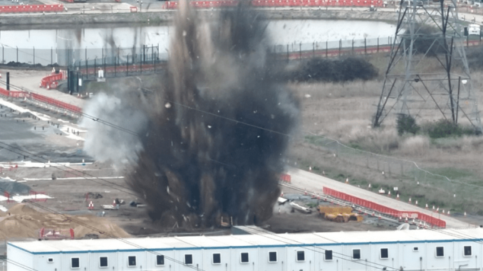 Watch dramatic moment WW2 bomb weighing 39 STONE is blown to smithereens as squads swarm street with trains axed