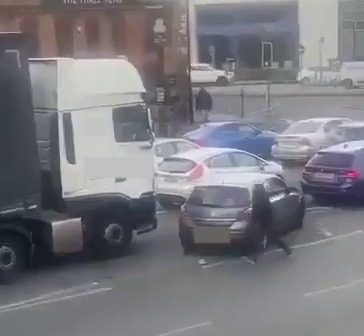 The fuming motorist swerved across the lane to create a roadblock