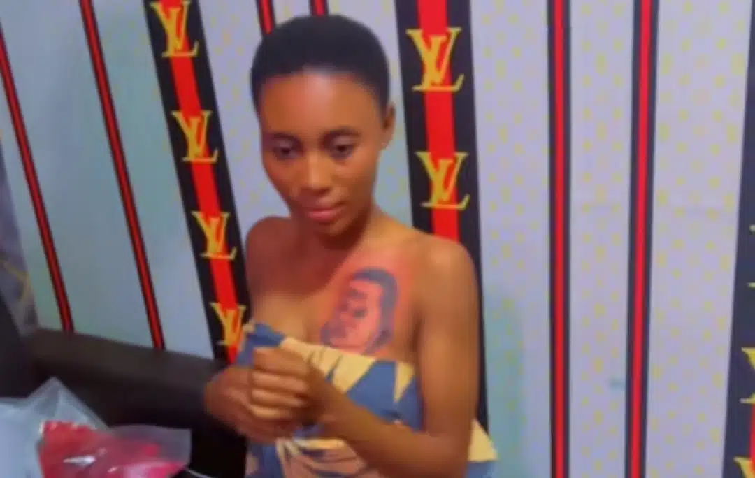 Lady tattoos boyfriend's face on her chest to prove her love