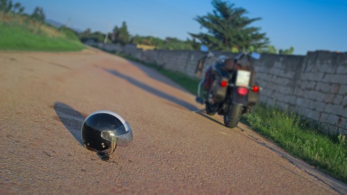 What does a helmet on the ground behind a motorcycle mean? Biker signal explained