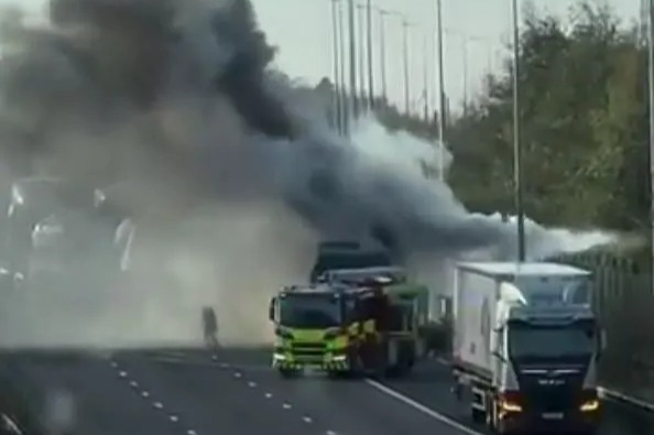 Moment lorry explodes into HUGE fireball on M62 as plumes of black smoke fill sky sparking traffic chaos for thousands