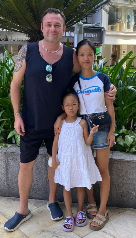 Allan Kato, 48, with his Vietnamese wife and eight-year-old stepdaughter