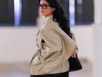 Kylie Jenner looks incredible as she's spotted out in black boots, a trench coat and glasses