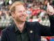 Smiling Prince Harry gives thumbs up to Canadian football fans in ANOTHER public appearance without Meghan – The Scottish Sun