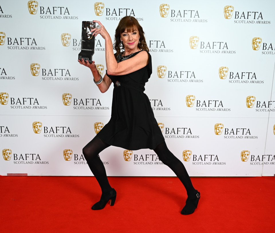 Doon Mackichan poses with the Actress Television Award for ‘Two Doors Down’