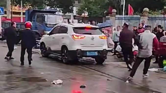 Driver ploughs SUV into kids outside school before being dragged out & beaten days after 35 killed in China ram attack