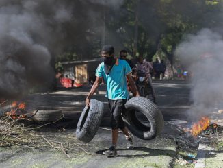 Vigilantes chop up mobsters & burn bodies in 'world's most dangerous city' after Haiti warlord 'Barbecue' vows coup