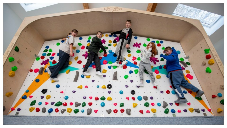 The kids scramble up the climbing in the new activity centre by Ardvullin House.