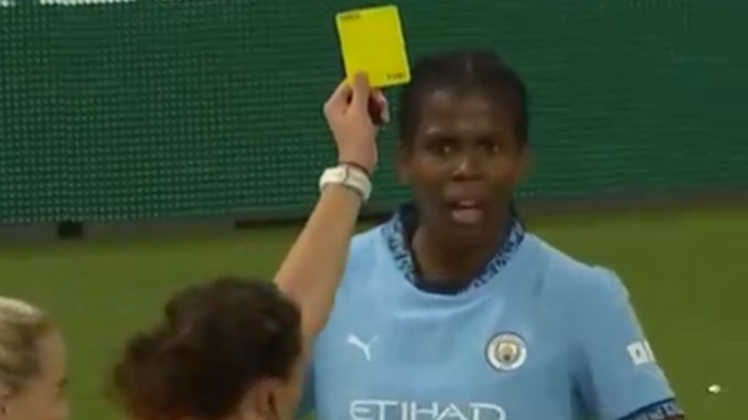 Moment baffled Man City star is BOOKED after being hit by projectile thrown from crowd when she scored