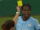 Moment baffled Man City star is BOOKED after being hit by projectile thrown from crowd when she scored