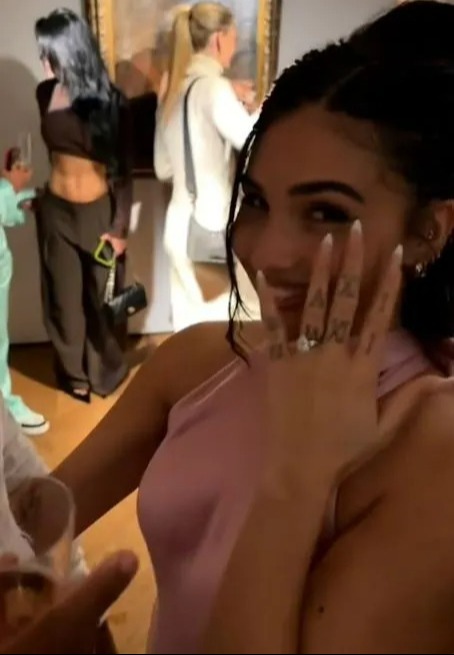 The songstress showed off her huge engagement ring