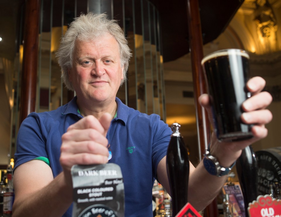 Wetherspoon founder and chairman Sir Tim Martin pours a pint