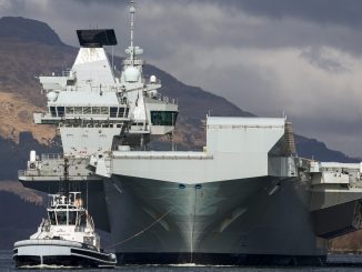 Unidentified drone 'follows' UK's £3bn flagship aircraft carrier - days after fleet of devices fly over three RAF bases