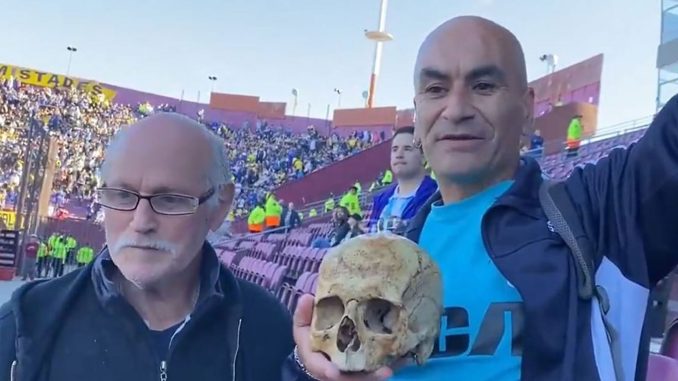 Bizarre moment football fans turn up to cup final with HUMAN SKULL of grandfather and say 'we take him everywhere'