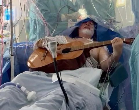 Watch the moment man plays guitar while having brain surgery to remove ‘golf ball-sized’ tumour – The Scottish Sun