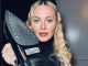 Madonna, 66, stuns as she poses with steam iron and cocktail in quirky online snap