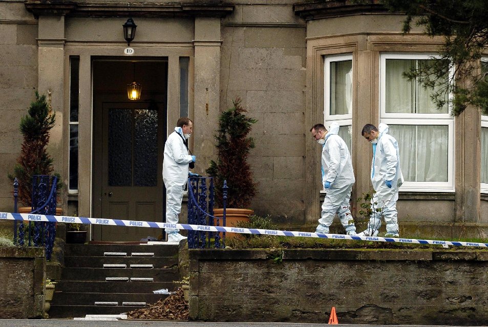 Forensics experts probed the Wilsons’ home for clues in 2004