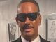 Company boss sparks outrage after 'blacking up' to go to firm's Christmas party as Will Smith