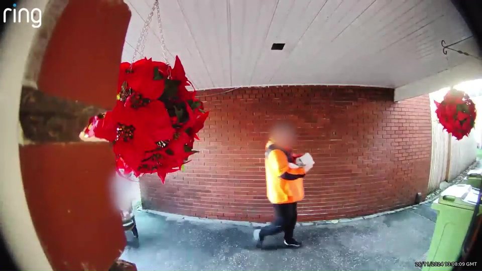 The couple are seen casually walking by - before approaching the bin