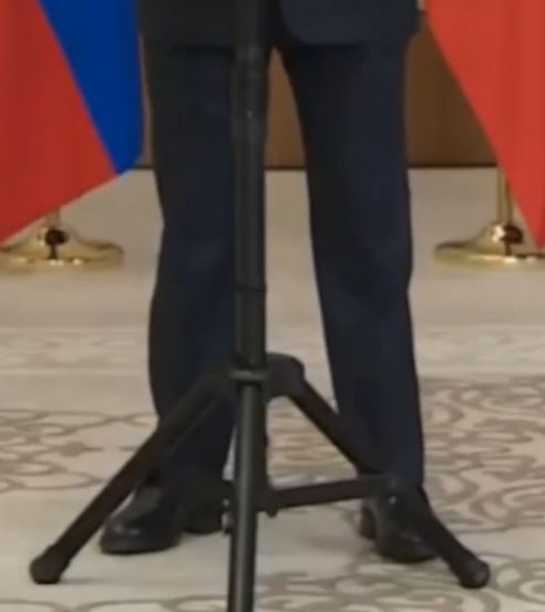 The Russian leader's feet and legs twitched and moved in an unusual manner as he spoke